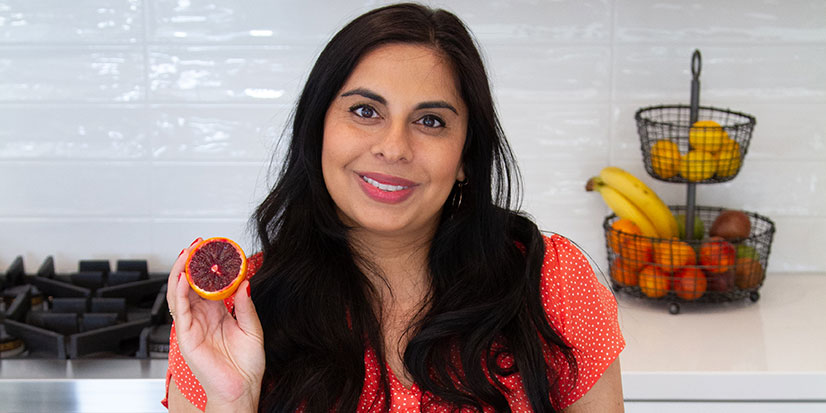 Nutritionist holding fruit